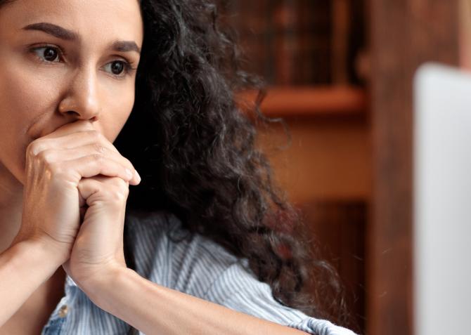 Stressed out woman stays calm while working on computer