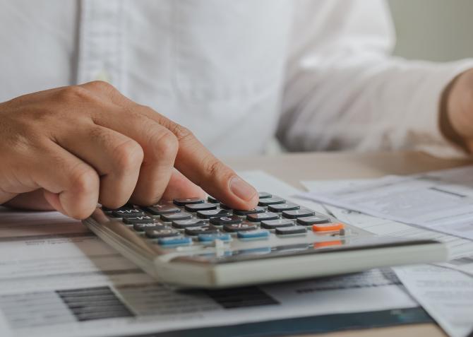 business man working on calculator