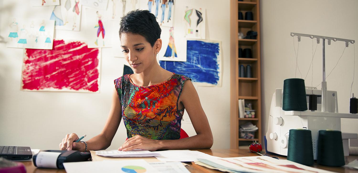 An entrepreneur goes over financing options while sitting at a table.