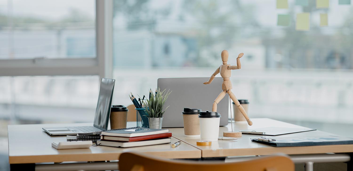 An image showing no one at their desk in an office setting.