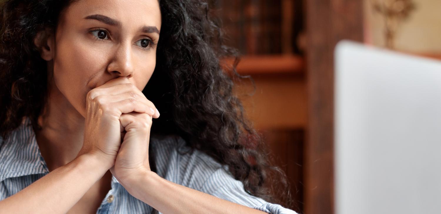 Stressed out woman stays calm while working on computer