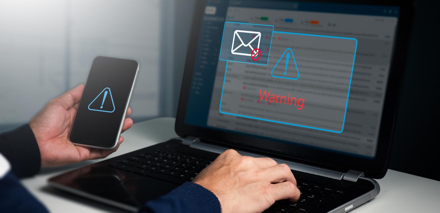 cyber threat alert in email inbox and mobile phone