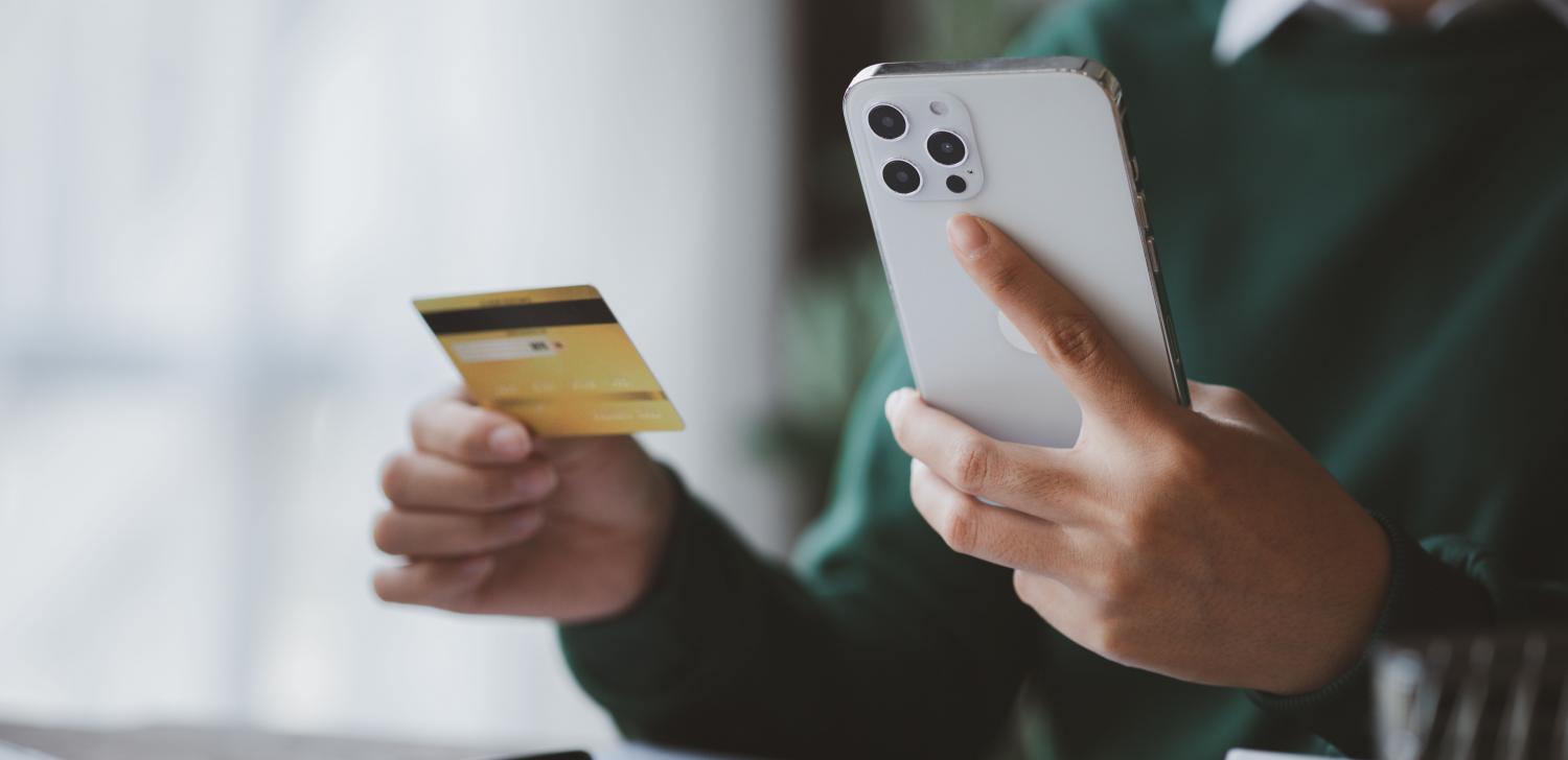 woman with credit card and iphone